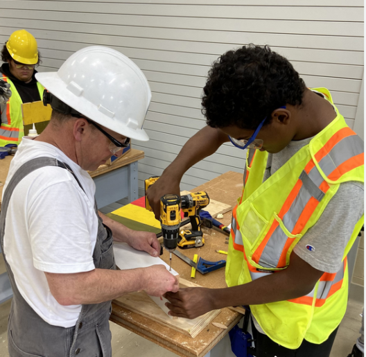 2 people working on carpentry