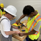 2 people working on carpentry